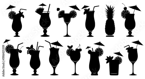 Cocktail glasses and tropical drinks with umbrellas on a table