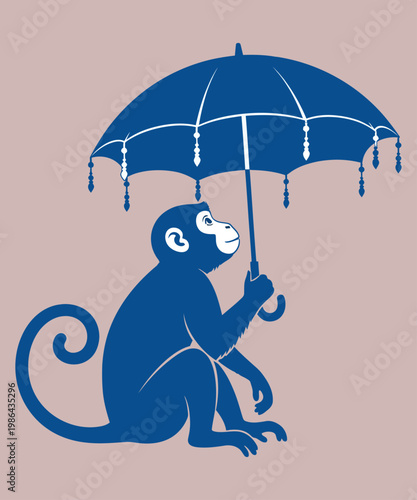 Monkey sitting under an umbrella in the rain