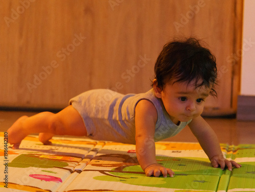 exploring  baby learning to crawl
