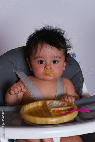 Cute Baby Eating First Food