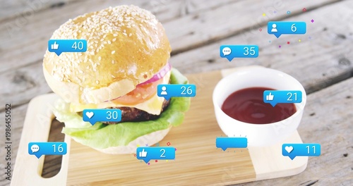 Showing sesame-seed burger sitting on cutting board on rustic table, with ketchup and social icons