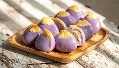 Artfully Arranged Purple Taro Dumplings with Fluffy Interior on a Rustic Wooden Tray, Bathed in Sunlight.