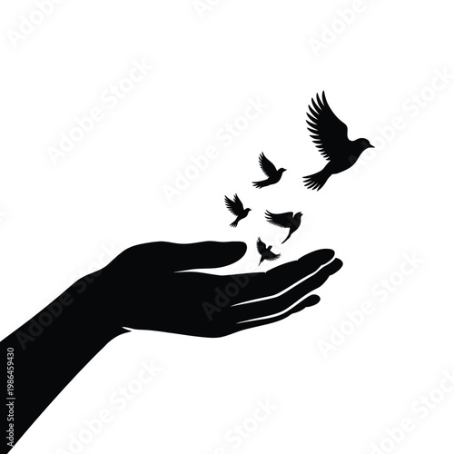 A hand releasing several birds into the air a symbol of freedom
