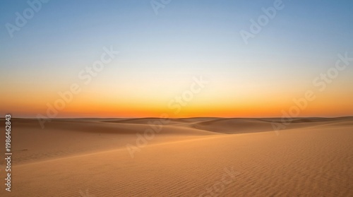 Rolling sand dunes in desert landscape at sunset or sunrise with sky, landscape