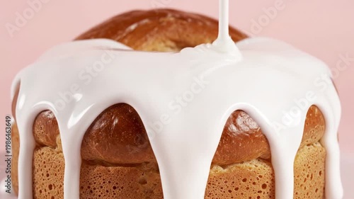 Close-up of a Delicious Orange Donut with White Icing Drizzle