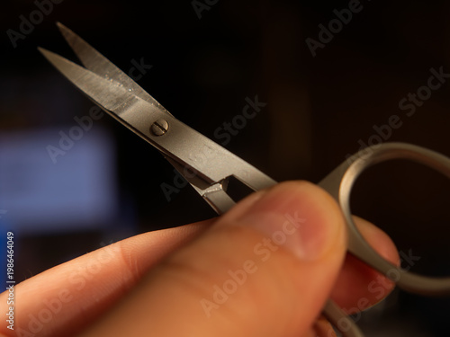 Precision Scissors Held by Hand in Close-Up