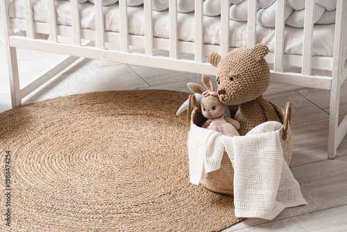 Wicker basket with toys on ...