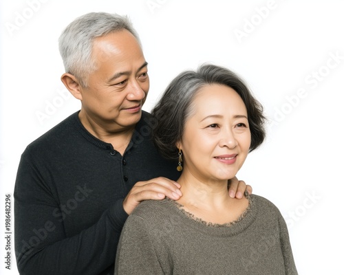 Happy elderly couple enjoying a tender moment together, showcasing love and connection against a clean white background.
