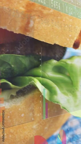 Vertical video: Burger entering frame after blue sweep, charts tickers overlaying burger for sales