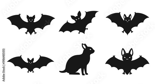 Set of diverse black bat silhouettes in various flight and resting positions, complemented by a unique rabbit silhouette, ideal for Halloween, nocturnal wildlife, and autumn designs