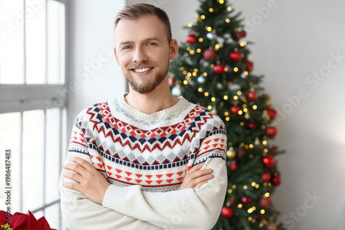 Young man in sweater at hom...