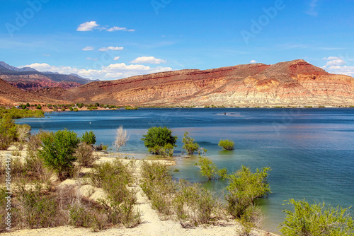 Deep Blue Water of Quail Creek Reservoir and State Park in the Spring near Hurricane Utah.  View also includes the Campground on the Lake Shore. and the Pine Valley Mountains in the Distance.