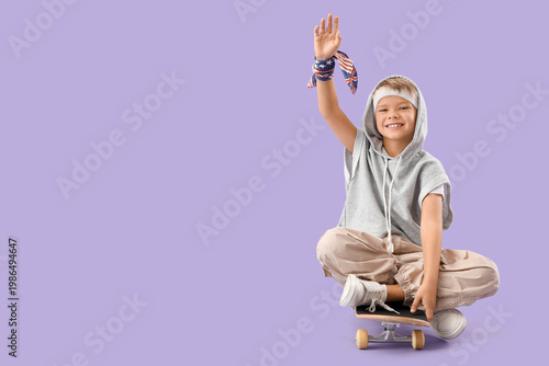 Little boy sitting on skate...