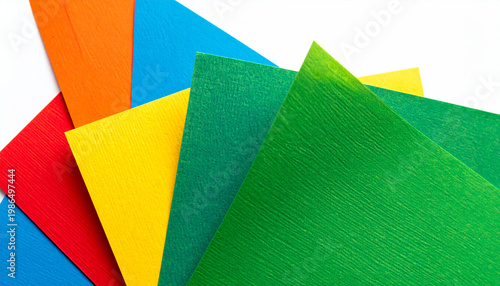 Fan of brightly colored textured paper sheets fanned out on white background
