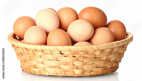 A woven basket overflowing with fresh brown and white chicken eggs on a clean white background