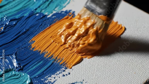 Wallpaper Mural Paintbrush applying thick orange paint on a textured canvas Torontodigital.ca