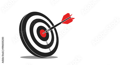 Red dart successfully hits the exact center bullseye of a black and white target board as a symbol of precision, success, and hitting goals.