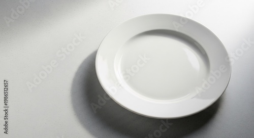 Elegant White Plate on a Bright Surface Minimalist Culinary Presentation.