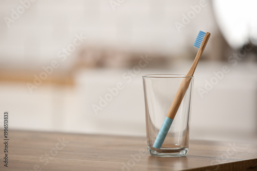 Glass with bamboo toothbrus...