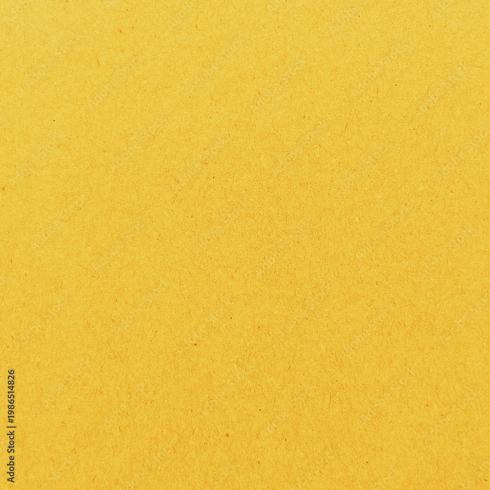 Fototapeta premium Vibrant textured yellow background with copy space