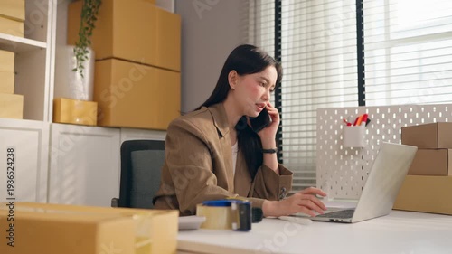 Frustrated woman talking on phone with customer in small home office. 