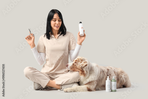 Female groomer with pet acc...