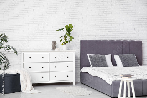 Bed, chest of drawers, hous...