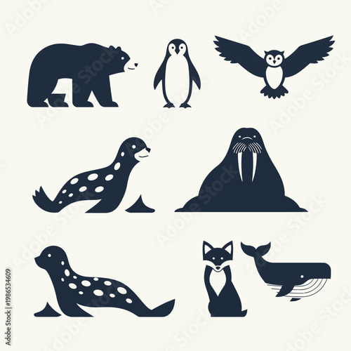 A collection of stylized dark blue flat design silhouettes depicting various polar region animals.