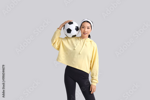 Happy young sporty Asian wo...