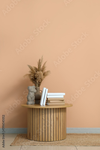 Books, vase with pampas gra...