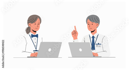 Two office workers sitting at their laptops with ID badges while the male colleague points his finger up as if suggesting a new idea or solution.