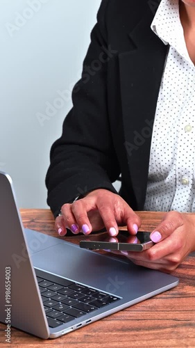Close-up of a female executive's hands using a high-end smartphone