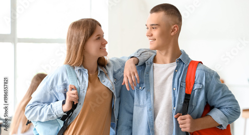 Happy students with backpac...
