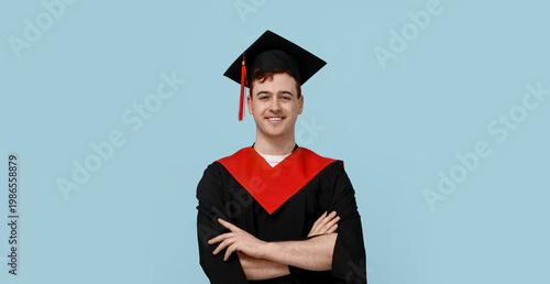Happy male graduating stude...