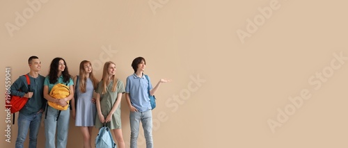 Group of students on beige background with space for text