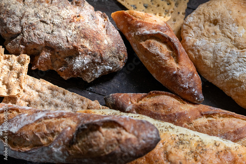 Tableau sur toile Assorted artisanal breads on display.