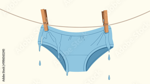 Pair of blue female underwear pinned with wooden pegs hangs on a laundry line dripping with water against a light plain background.