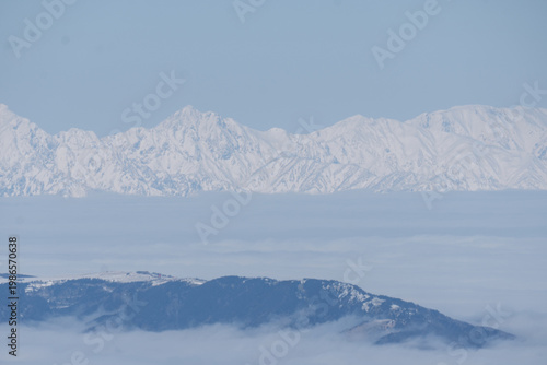 The snow-capped Japanese Alps as seen from Mount Yatsugatake