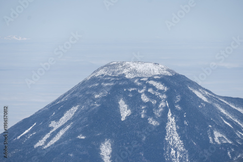 The snow-capped Japanese Alps as seen from Mount Yatsugatake