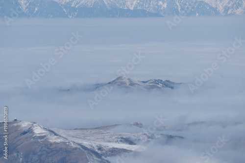 The snow-capped Japanese Alps as seen from Mount Yatsugatake