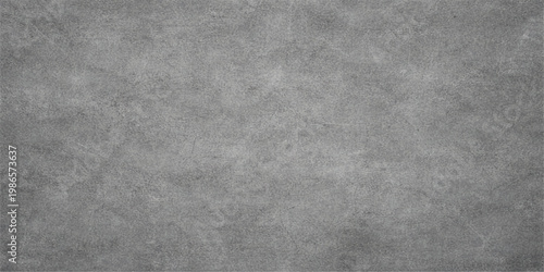 A dark grunge backdrop featuring a rough black leather texture merged with a vintage grey metal surface to create an aged industrial design pattern on a dirty concrete wall