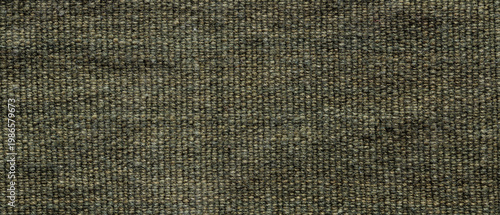 Dark olive green coarse woven burlap fabric texture background close-up