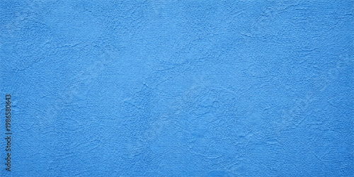 A close-up of a rustic blue painted wall surface featuring a rough grunge texture that creates an artistic patterned backdrop reminiscent of wet swimming pool water and aged paper material