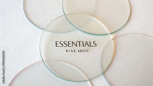 Stylish Transparent Glass Circles with Inspirational Text on White Background for Modern Decor and Design Projects