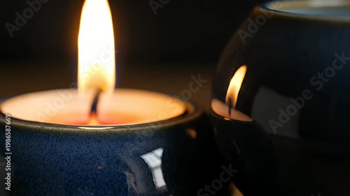 Wallpaper Mural Lit candle in blue ceramic holder with flame reflection Torontodigital.ca