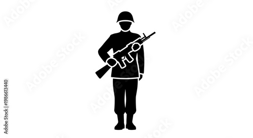 Soldier holding a rifle standing.