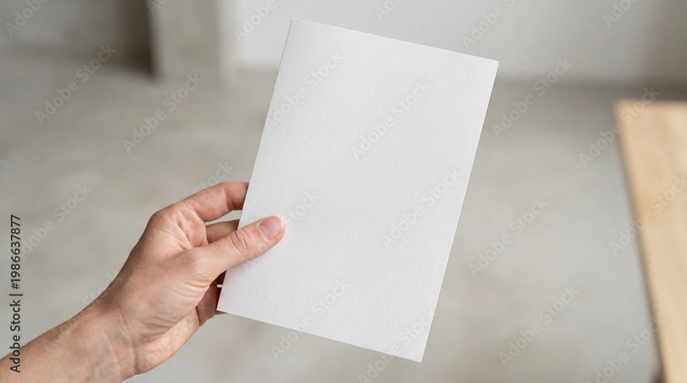 Obraz premium Minimal Paper Flyer Mockup In Hand Closeup