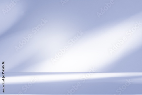 Wall interior background, studio and backdrops show products.with shadow from window color white and blue background for text insertion and presentation product	