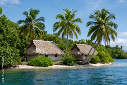 Traditional bungalows on tropical beach with palm trees
