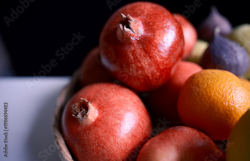 Assorted ripe fruits in low key lighting with rich colors, ideal for nutrition, organic food, grocery, and healthy lifestyle concepts.